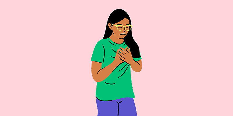 Teen holding chest pectus symptom